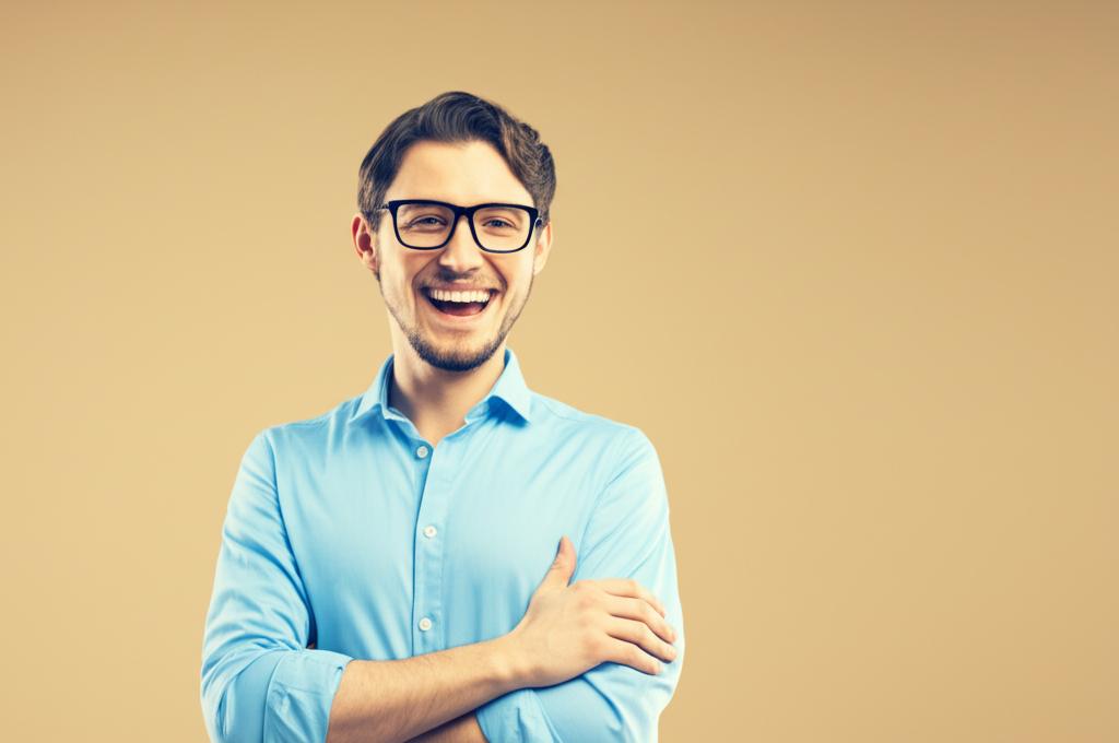 AI prompt: A smiling, energetic man (programmer type) looking confident and healthy.