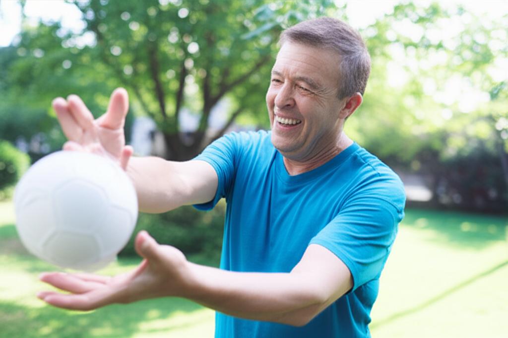 middle aged man smiling and looking energetic, maybe playing with grandchild or doing a hobby
